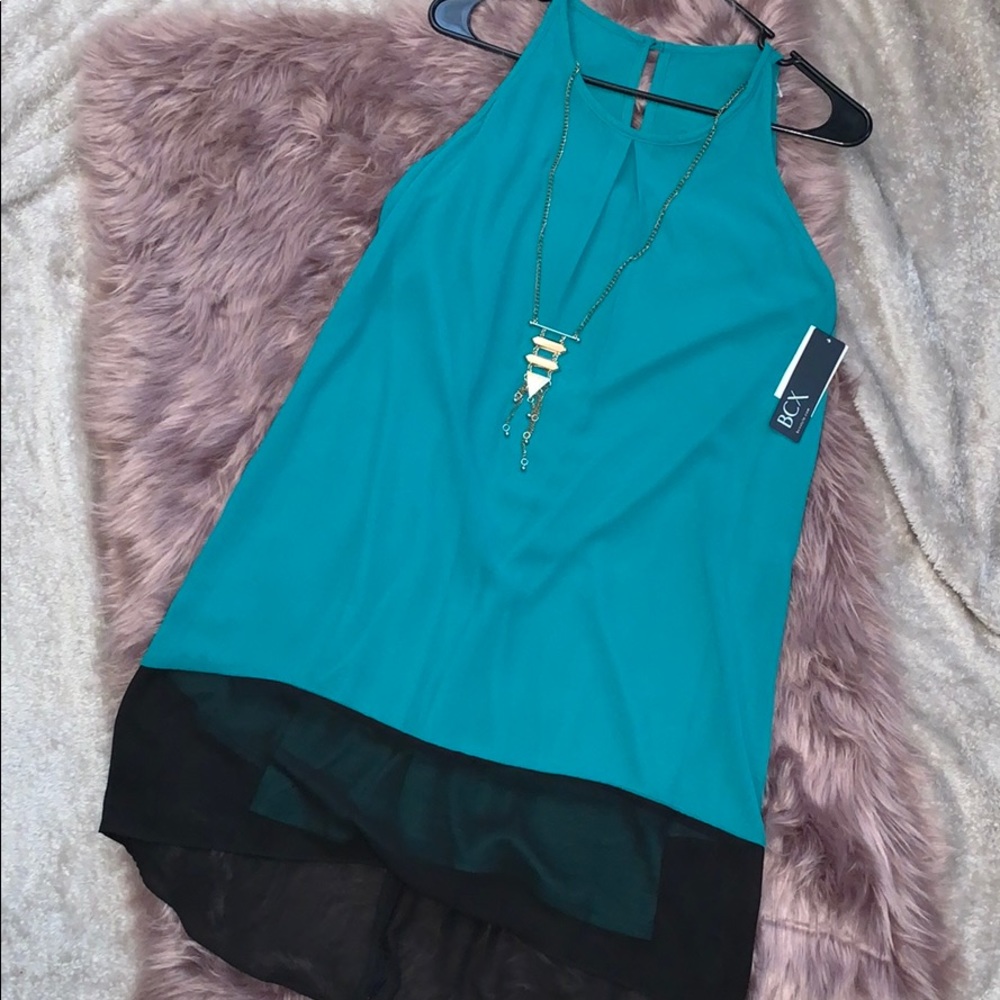 black and teal dress with gold necklace